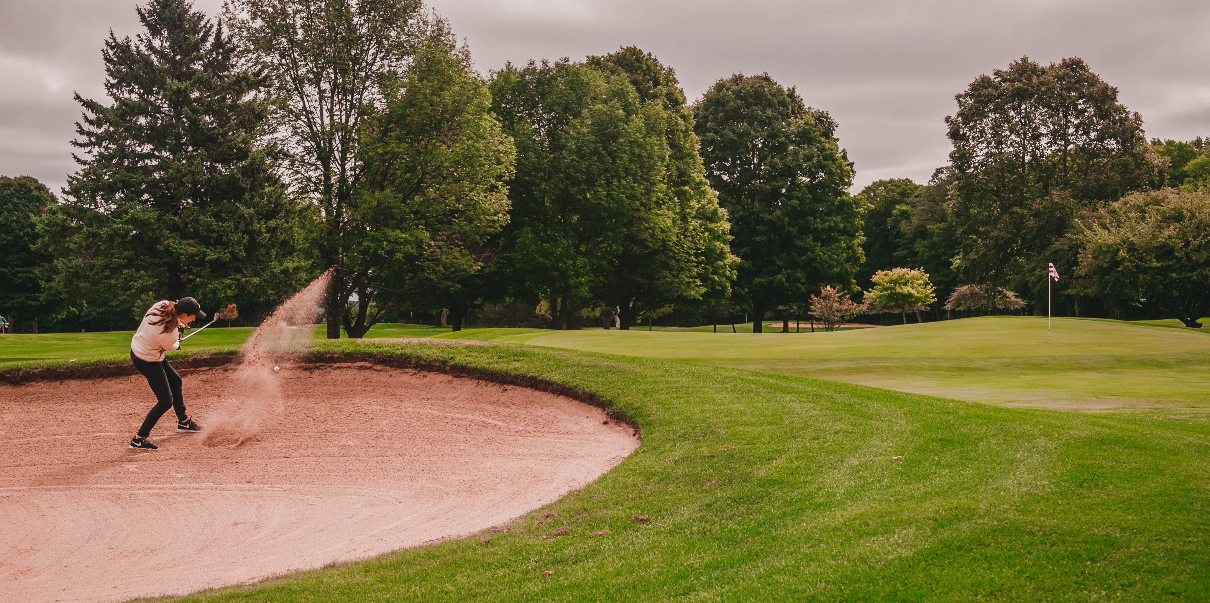 Do golf balls fly farther in warmer weather?